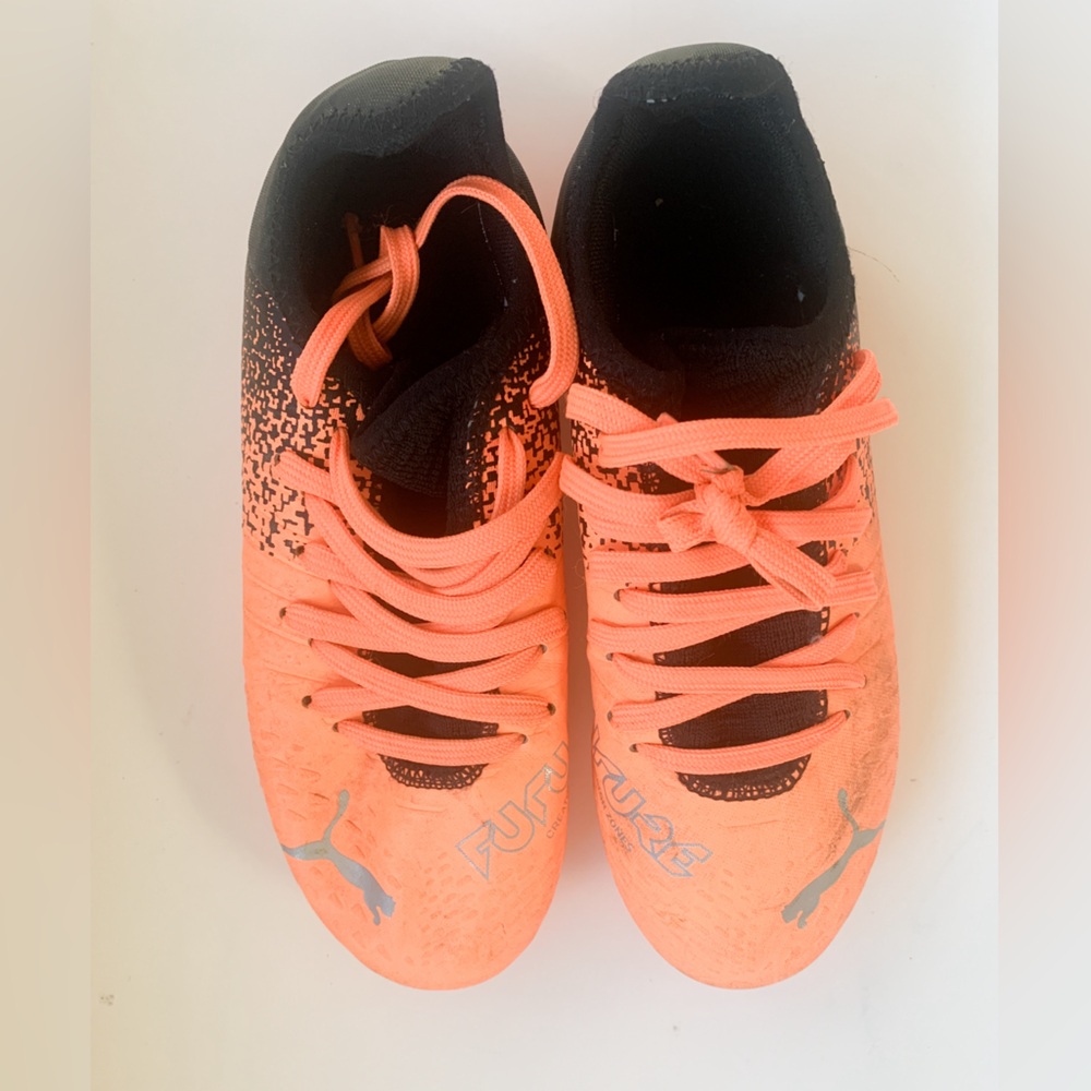 Orange Puma soccer shoes size 3